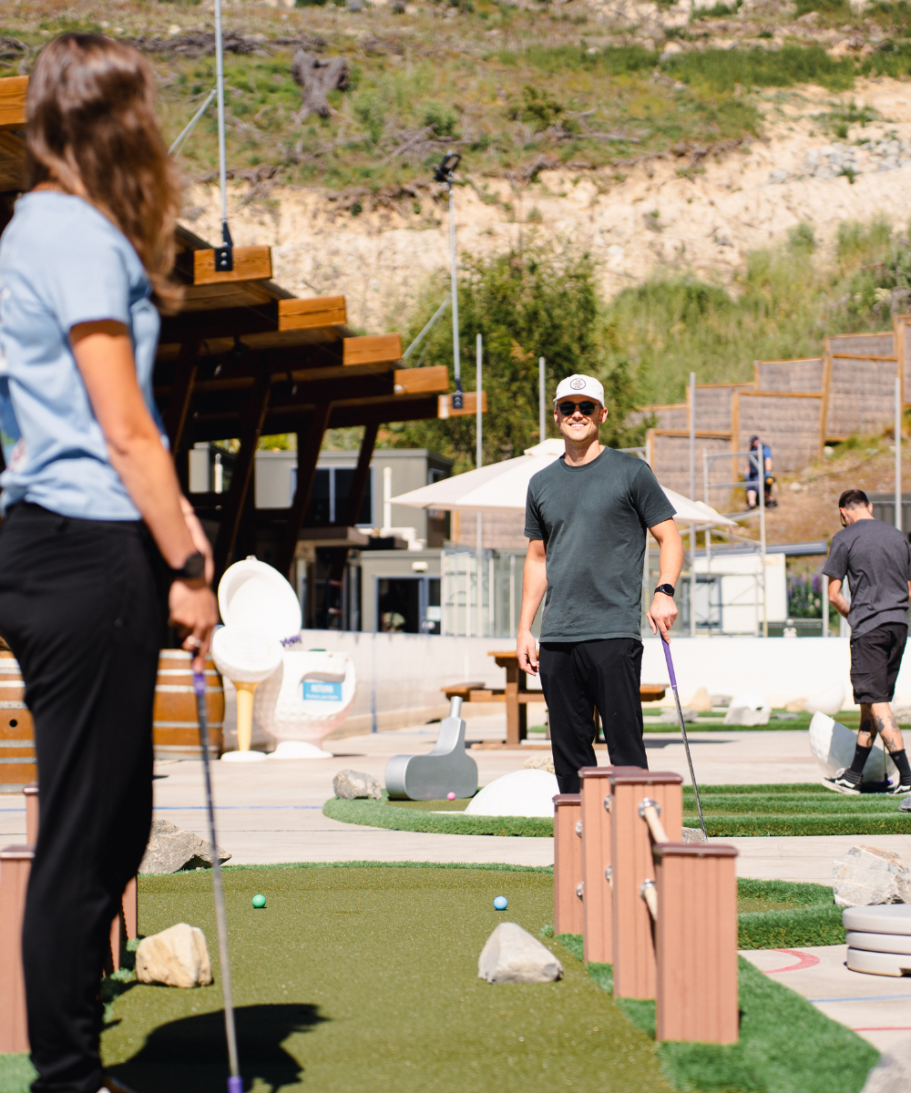 Two people enjoying Mini golf at tekapo springs